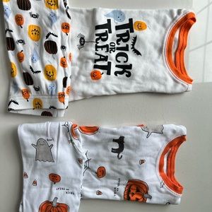 2T Two sets of Halloween pjs and a extra shirt